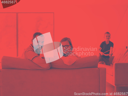 Image of family with little boy enjoys in the modern living room