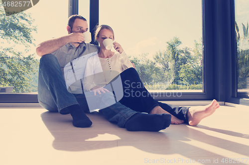 Image of romantic couple enjoying morning coffee