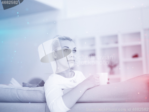 Image of woman enjoying a cup of coffee
