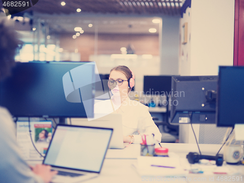 Image of businesswoman using a laptop in startup office