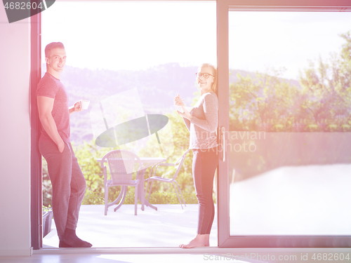 Image of couple on the door of their luxury home villa
