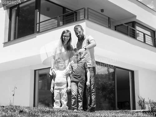 Image of happy family with children in the yard