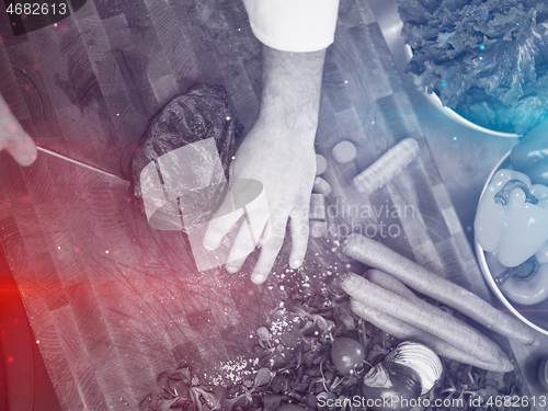 Image of closeup of Chef hands preparing beef steak