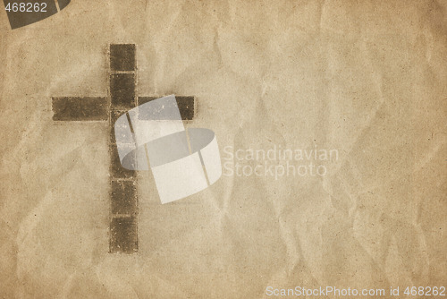 Image of christian cross on parchment