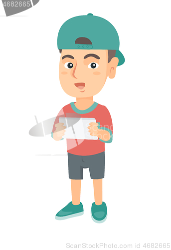 Image of Little caucasian boy using a tablet computer.