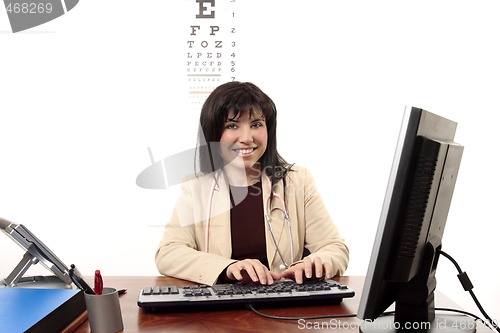 Image of Doctor sitting at office desk