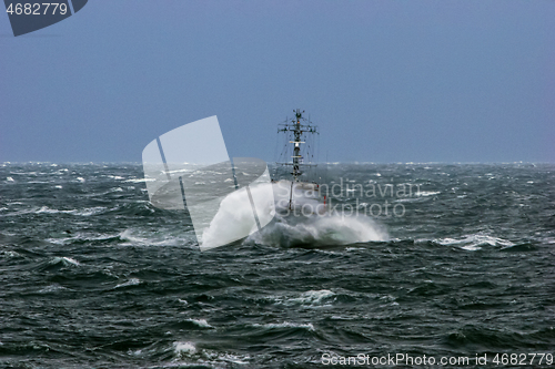 Image of NATO military ship at sea during a storm.