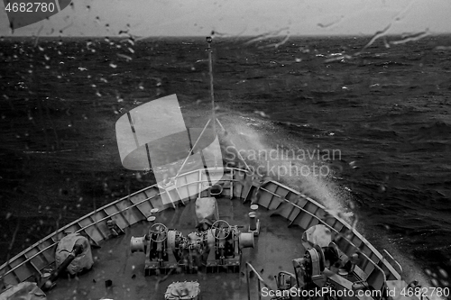 Image of NATO military ship at sea during a storm.