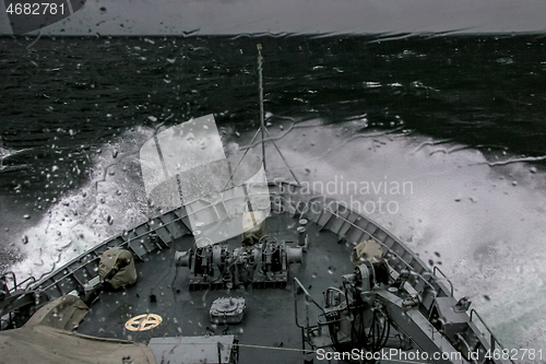 Image of NATO military ship at sea during a storm.