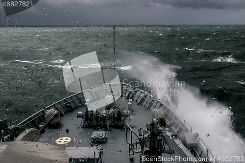 Image of NATO military ship at sea during a storm.