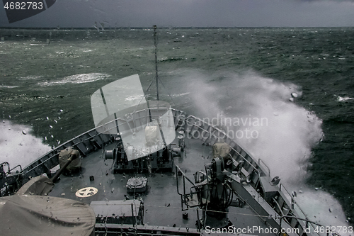 Image of NATO military ship at sea during a storm.