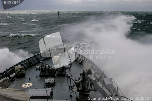 Image of NATO military ship at sea during a storm.