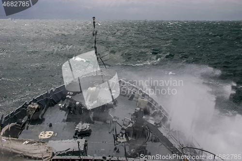 Image of NATO military ship at sea during a storm.