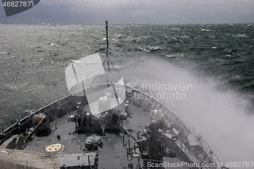 Image of NATO military ship at sea during a storm.