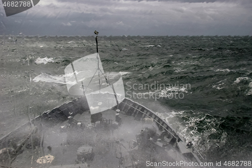 Image of NATO military ship at sea during a storm.