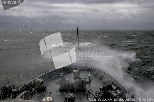 Image of NATO military ship at sea during a storm.