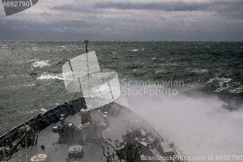 Image of NATO military ship at sea during a storm.