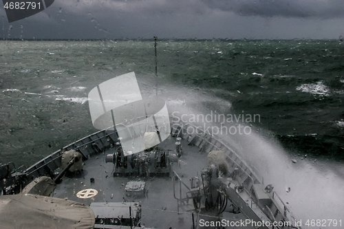 Image of NATO military ship at sea during a storm.