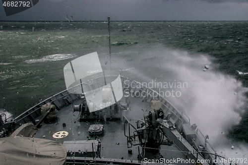Image of NATO military ship at sea during a storm.
