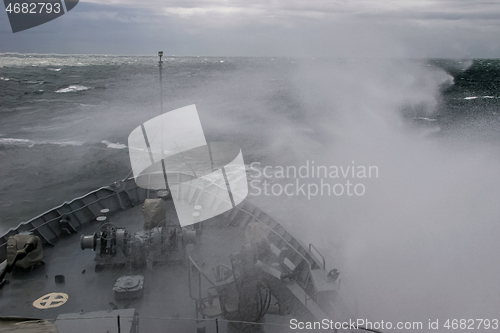 Image of NATO military ship at sea during a storm.