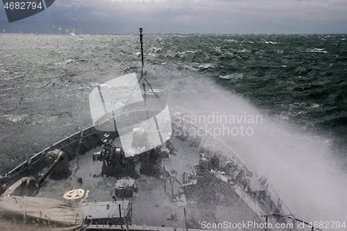 Image of NATO military ship at sea during a storm.