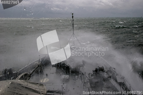 Image of NATO military ship at sea during a storm.