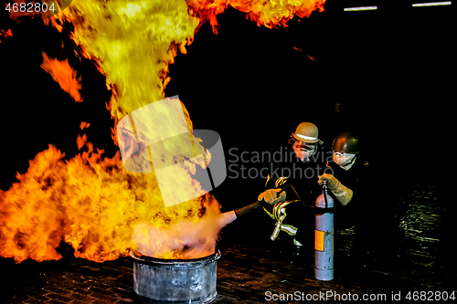 Image of Firefighters training for fire fighting.