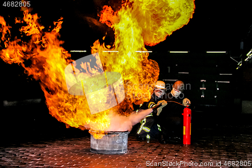 Image of Firefighters training for fire fighting.