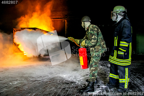 Image of Firefighters training for fire fighting.