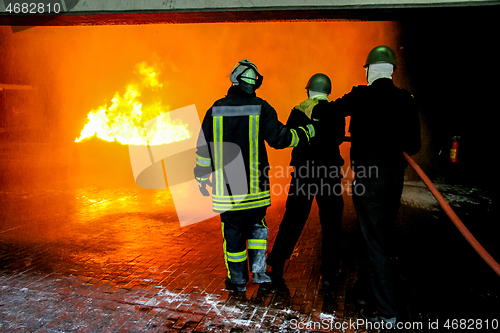 Image of Firefighters training for fire fighting.