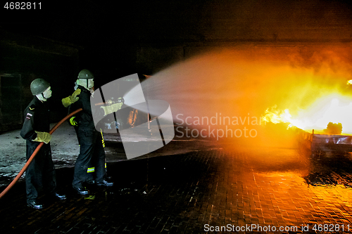 Image of Firefighters training for fire fighting.