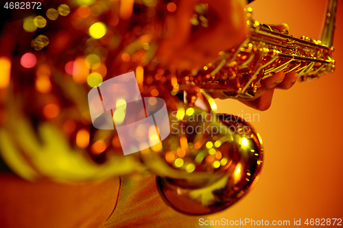 Image of African American jazz musician playing the saxophone.