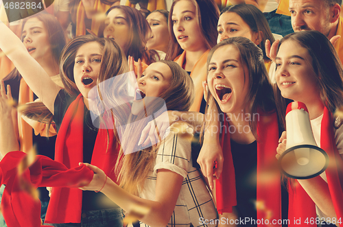 Image of Group of happy fans are cheering for their team victory.