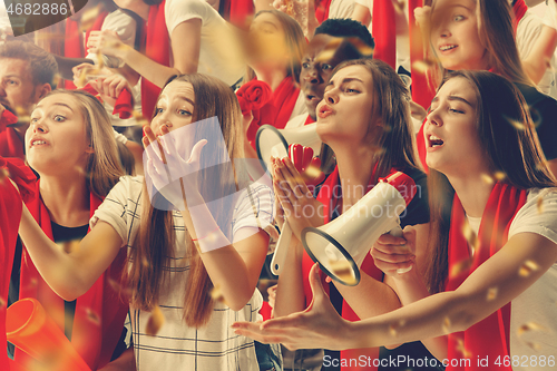 Image of Group of happy fans are cheering for their team victory.