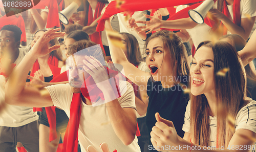 Image of Group of happy fans are cheering for their team victory.