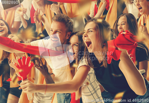 Image of Group of happy fans are cheering for their team victory.