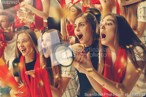 Image of Group of happy fans are cheering for their team victory.