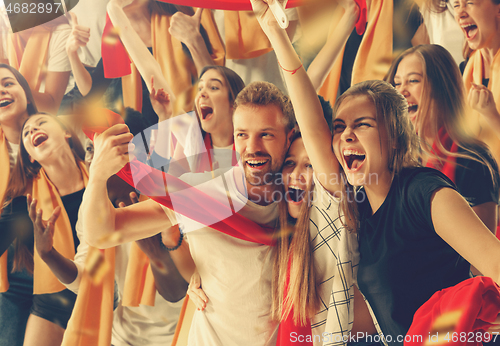 Image of Group of happy fans are cheering for their team victory.