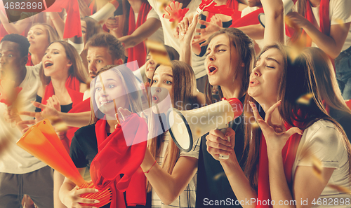 Image of Group of happy fans are cheering for their team victory.