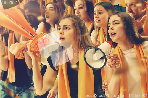 Image of Group of happy fans are cheering for their team victory.