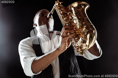 Image of African American jazz musician playing the saxophone.