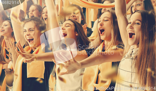 Image of Group of happy fans are cheering for their team victory.