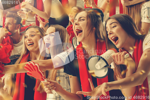 Image of Group of happy fans are cheering for their team victory.