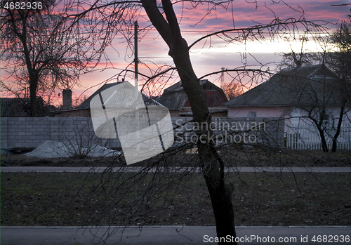 Image of dawn over private homes