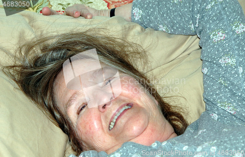 Image of Female in bed.