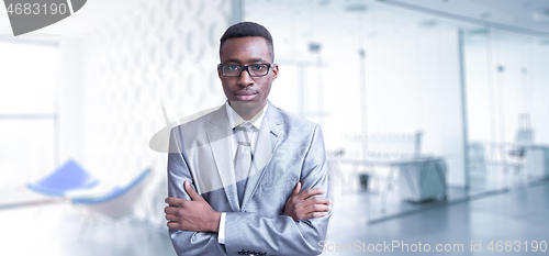 Image of Young businessman in his office