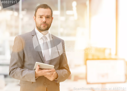 Image of Young businessman in his office