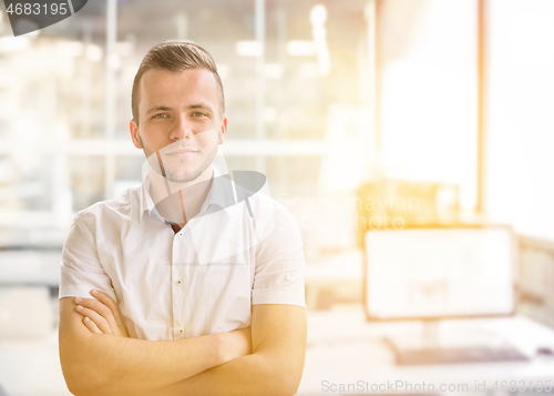 Image of Young businessman in his office