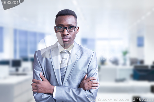 Image of Young businessman in his office