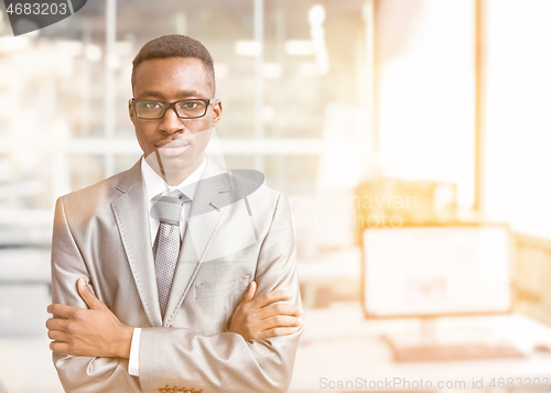 Image of Young businessman in his office